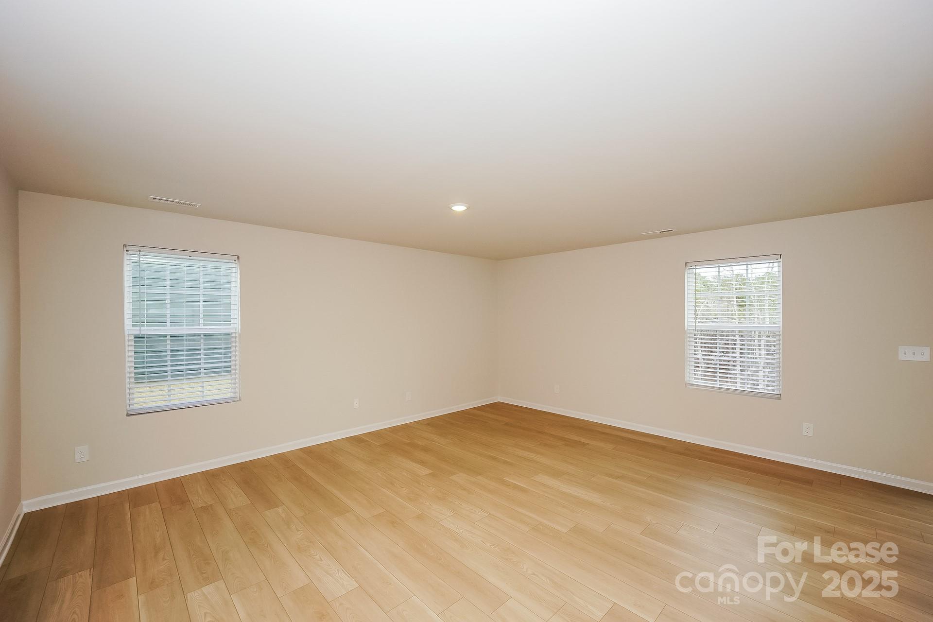 143 Arden Court Troutman, NC 28166 - Photo 8 of 18 an empty room with a window
