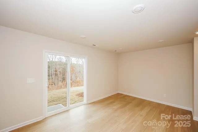 a kitchen with granite countertop a refrigerator stove top oven and sink