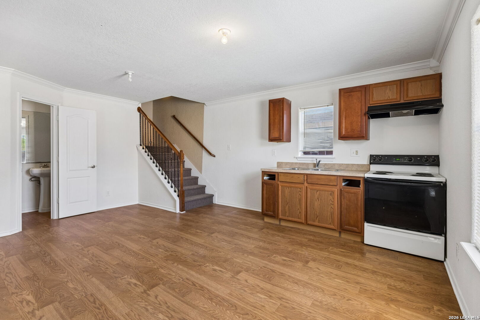 438 Rigsby Avenue San Antonio, TX 78210 - Photo 21 of 25 a kitchen with stainless steel appliances a stove microwave and a refrigerator