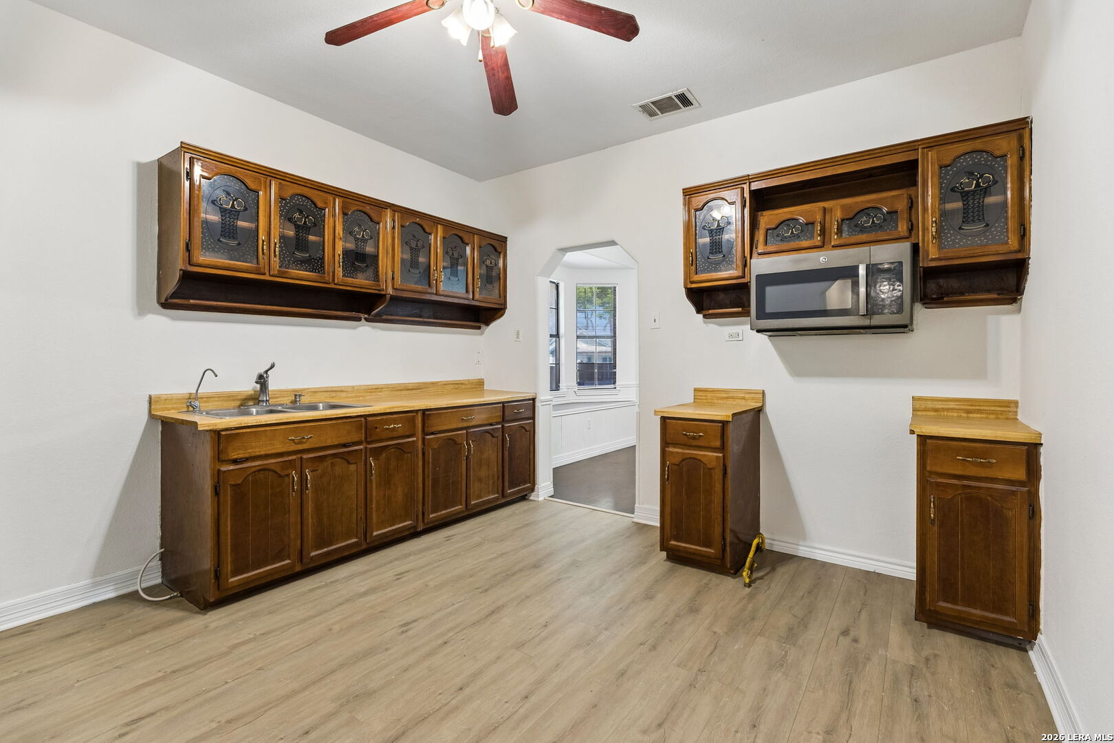438 Rigsby Avenue San Antonio, TX 78210 - Photo 10 of 25 a kitchen with stainless steel appliances granite countertop a stove and a sink