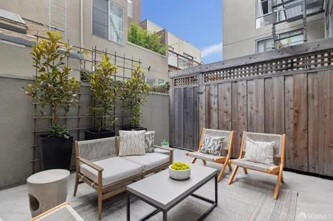 a view of a chairs and table in the patio