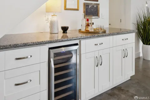 a spacious bedroom with a bed and a large window