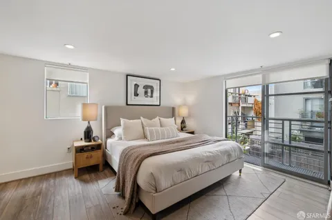 a bedroom with furniture and a window