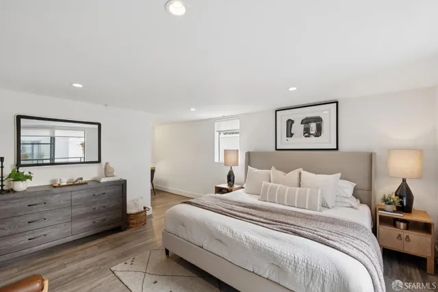 a bedroom with furniture and a window