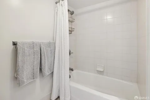 a view of a hallway with stairs