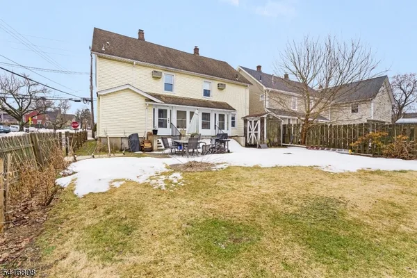 a view of a house with a snow in the yard