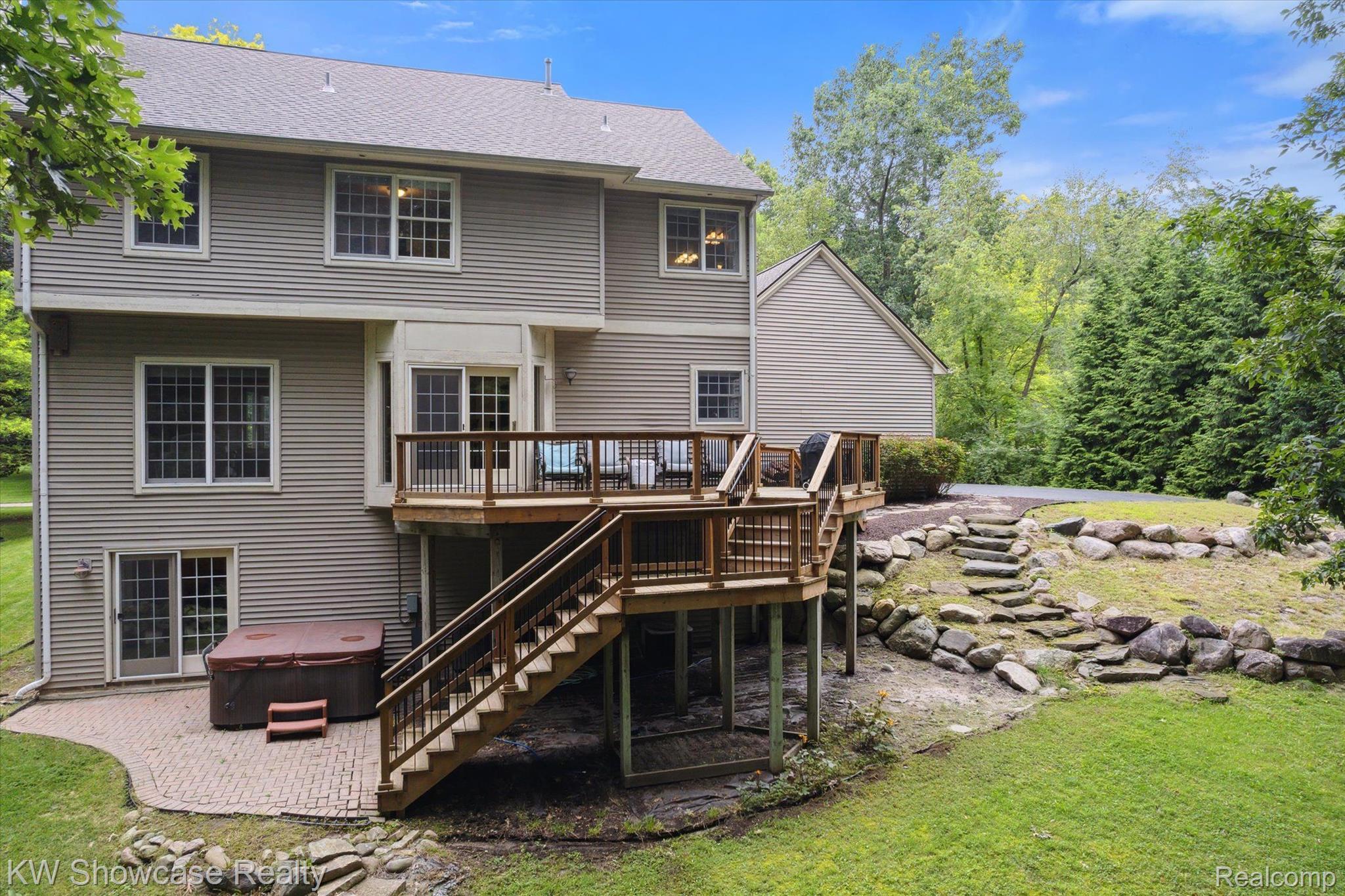 564 Timber Ridge Drive Highland, MI 48357 - Photo 35 of 40 What a beautiful rear elevation shot.