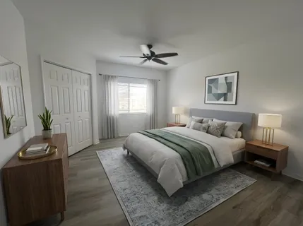 a bedroom with a bed and a couch
