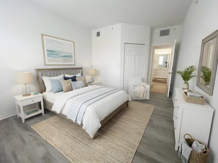 a bedroom with a bed and a couch