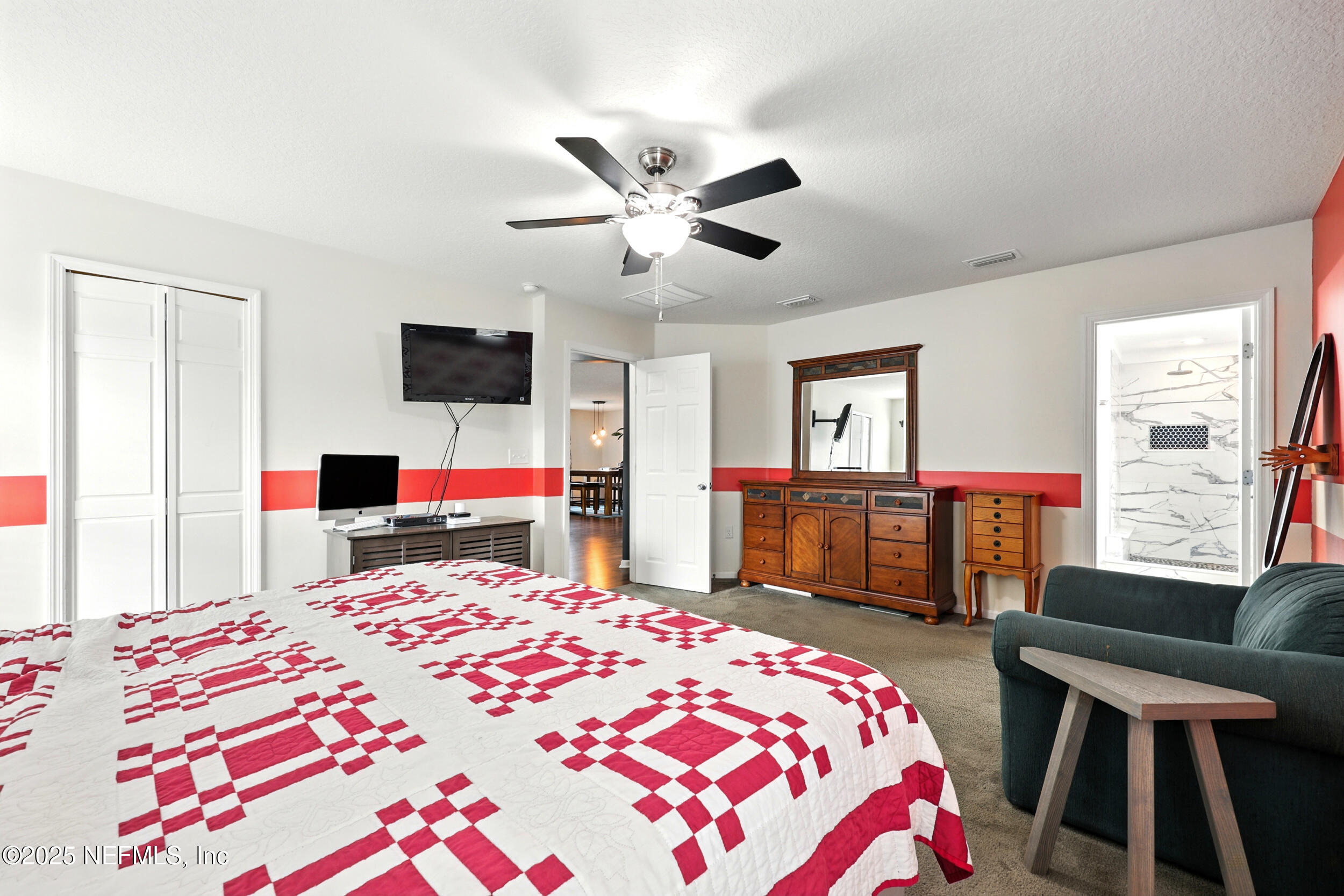 76866 Timbercreek Boulevard Yulee, FL 32097 - Photo 16 of 33 a bedroom that has a bed and a dresser in it