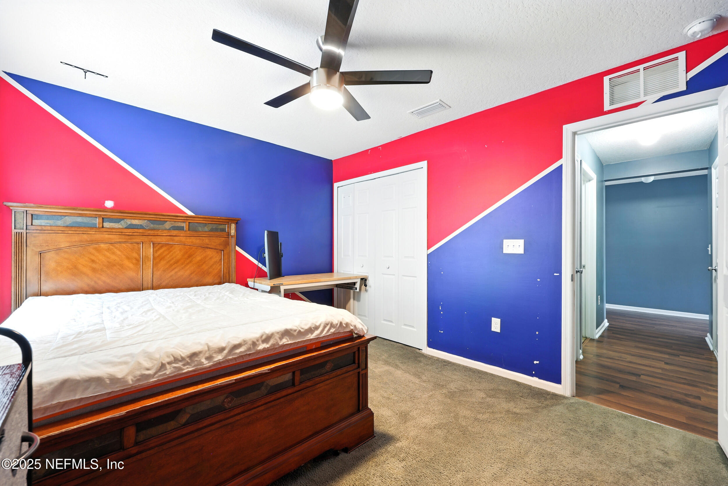 76866 Timbercreek Boulevard Yulee, FL 32097 - Photo 25 of 33 a room with a bed and a dresser