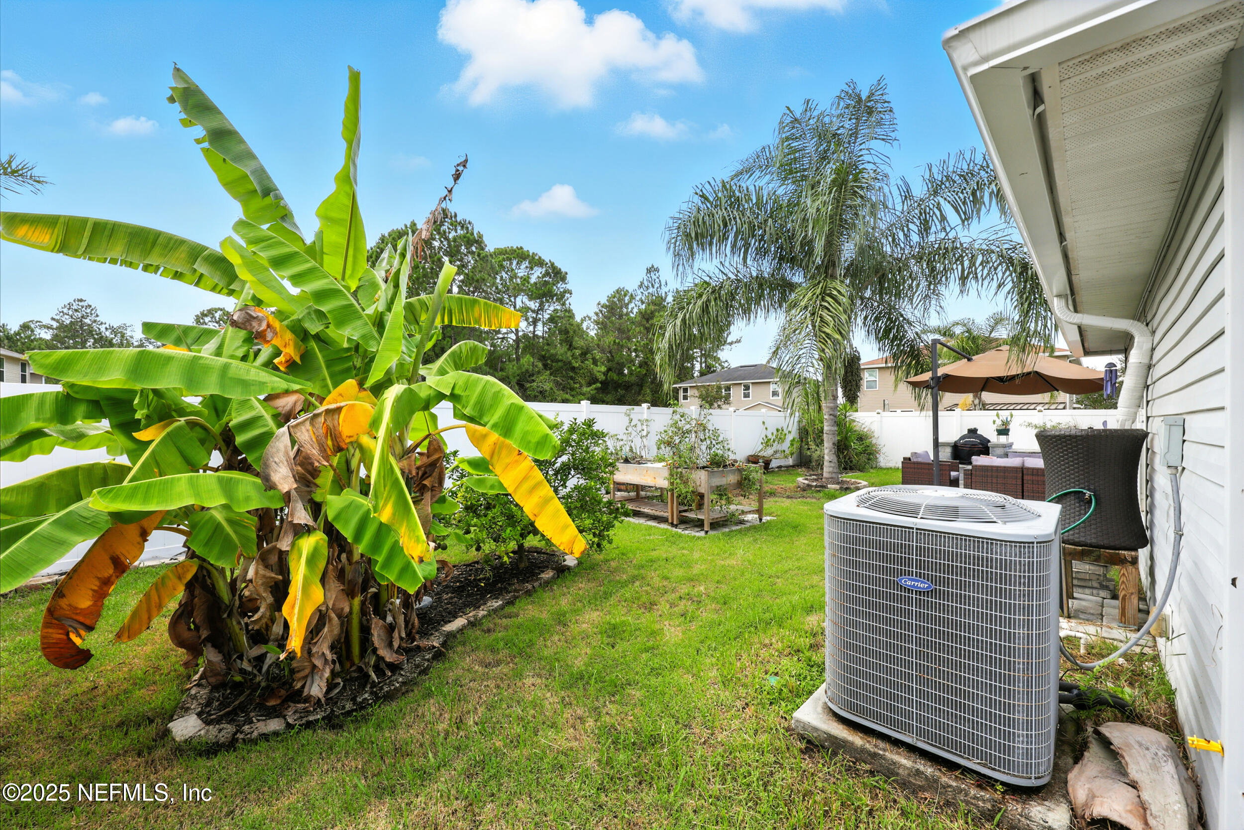 76866 Timbercreek Boulevard Yulee, FL 32097 - Photo 30 of 33 a view of a backyard with plants