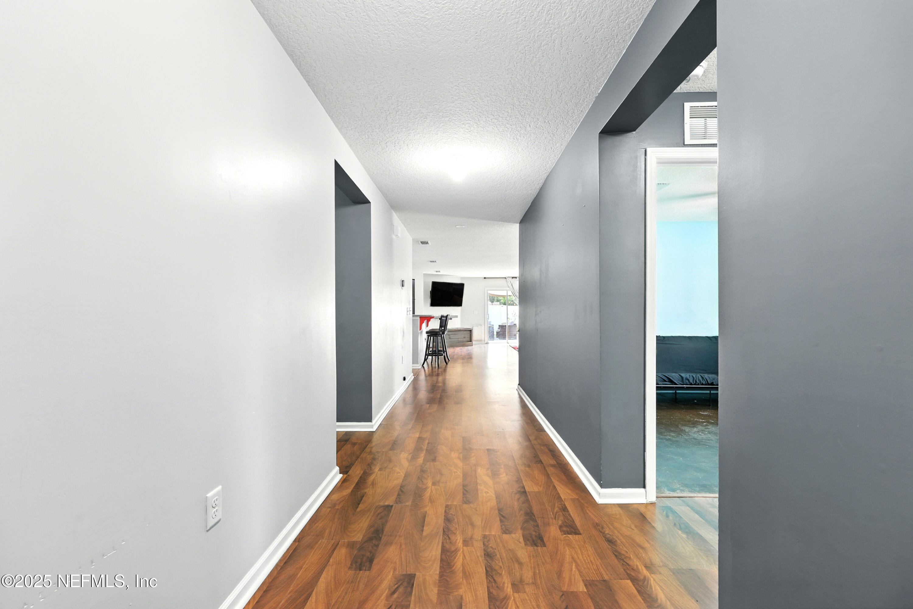 76866 Timbercreek Boulevard Yulee, FL 32097 - Photo 4 of 33 a view of a hallway view with wooden floor and staircase