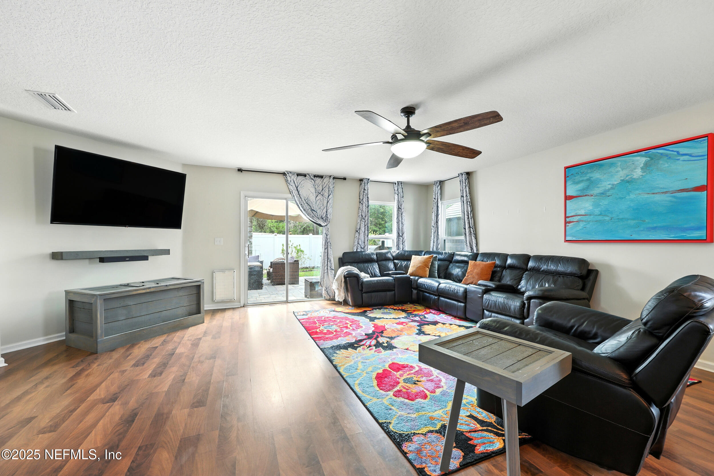 76866 Timbercreek Boulevard Yulee, FL 32097 - Photo 8 of 33 a living room with furniture and a flat screen tv