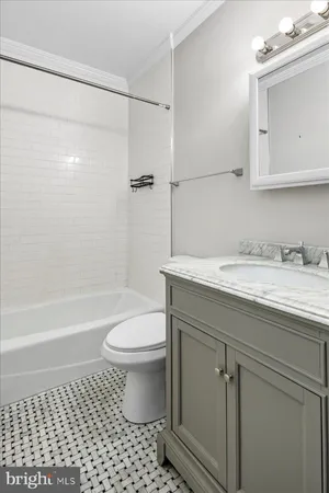 a bathroom with a sink a toilet and a bathtub
