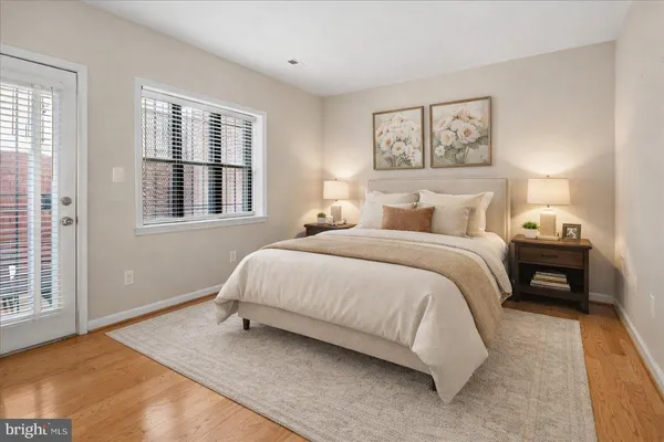 a bedroom with a large bed and a window