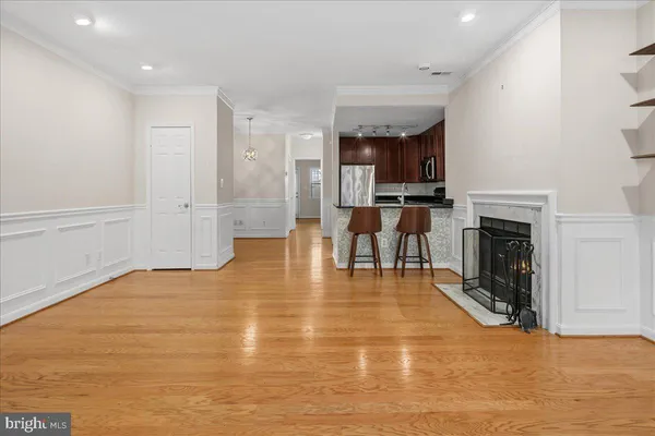 a view of an empty room with a fireplace
