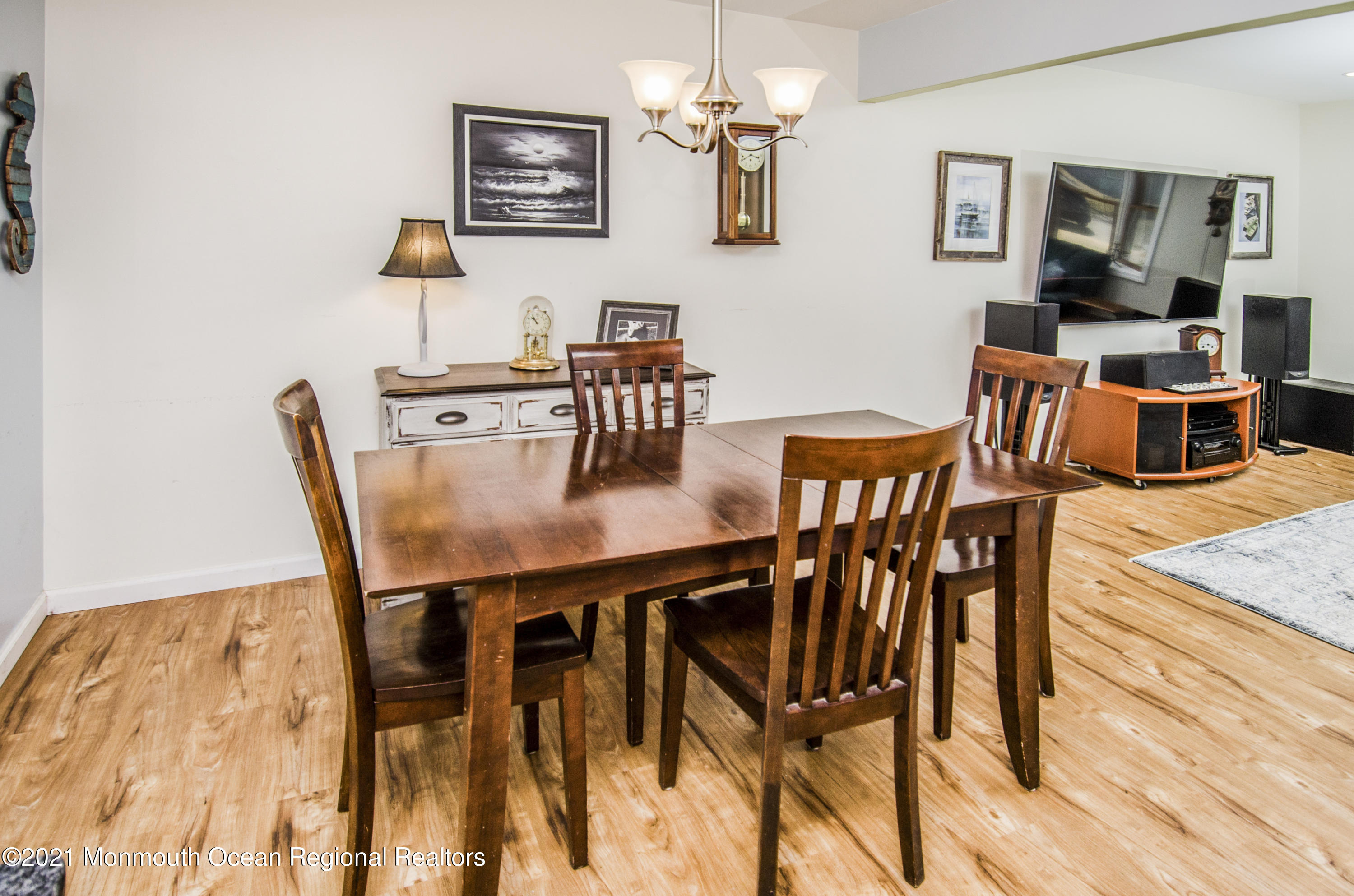 58 Pinewood Drive Brick, NJ 08724 - Photo 11 of 30 a dining room with furniture and wooden floor