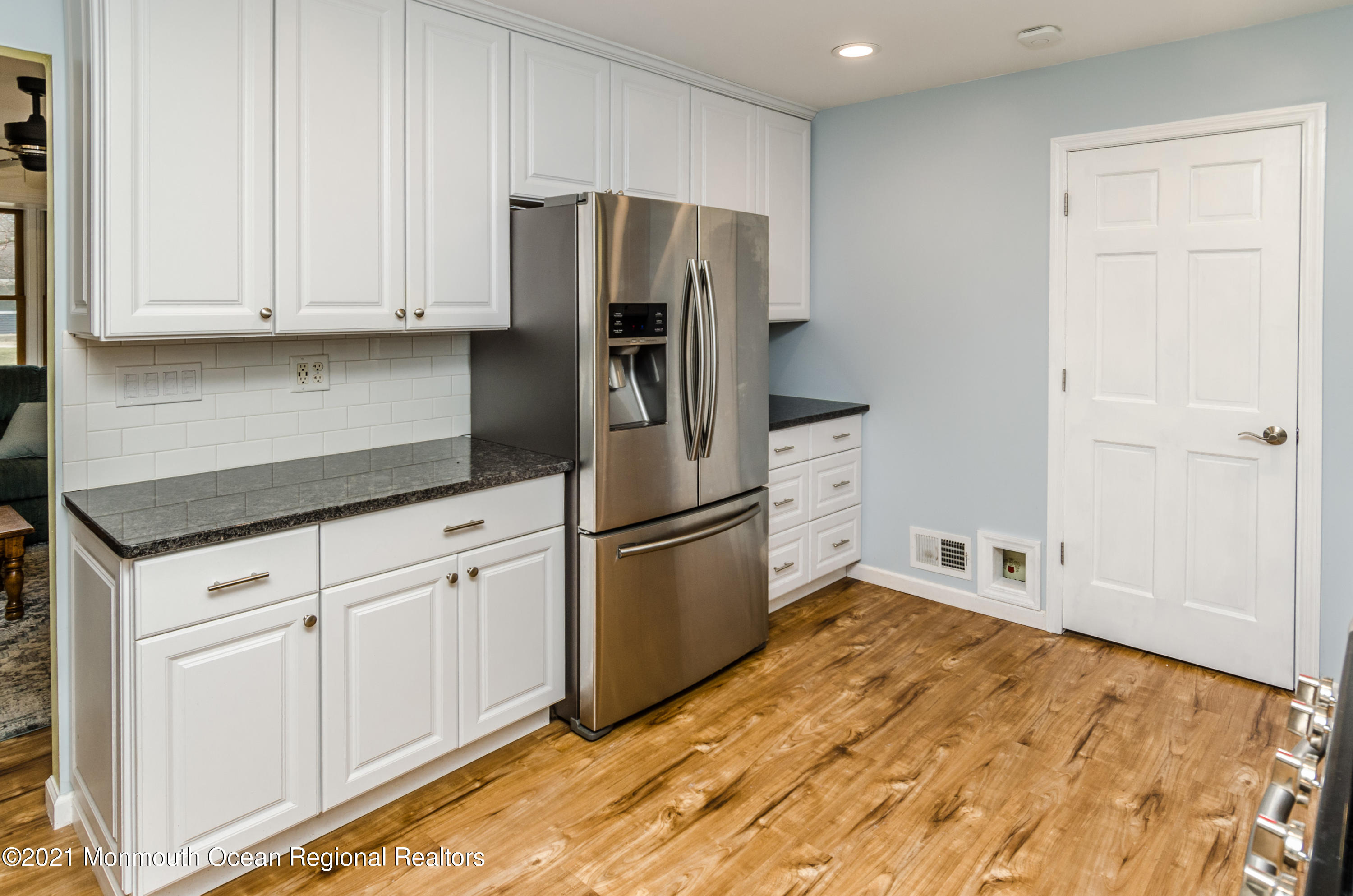58 Pinewood Drive Brick, NJ 08724 - Photo 14 of 30 a kitchen with stainless steel appliances granite countertop a refrigerator sink and cabinets