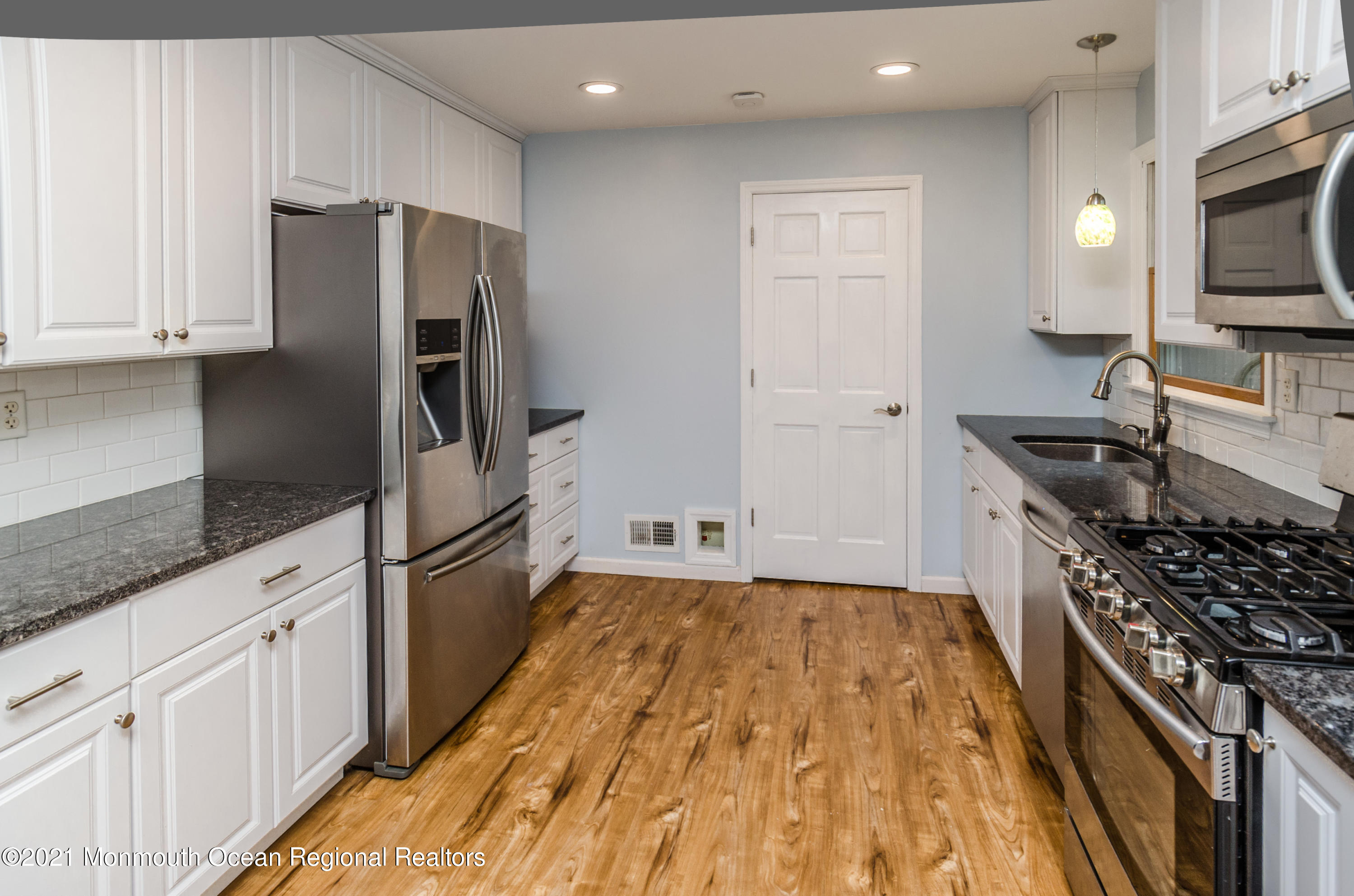 58 Pinewood Drive Brick, NJ 08724 - Photo 15 of 30 a kitchen with granite countertop a refrigerator stove and sink
