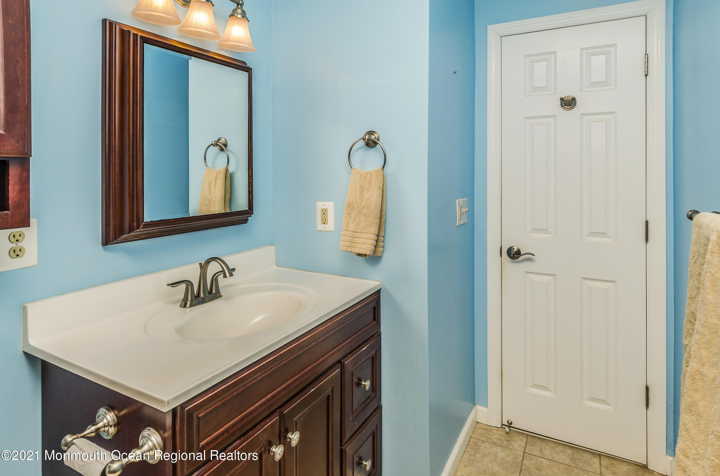 58 Pinewood Drive Brick, NJ 08724 - Photo 21 of 30 a bathroom with a sink and a mirror