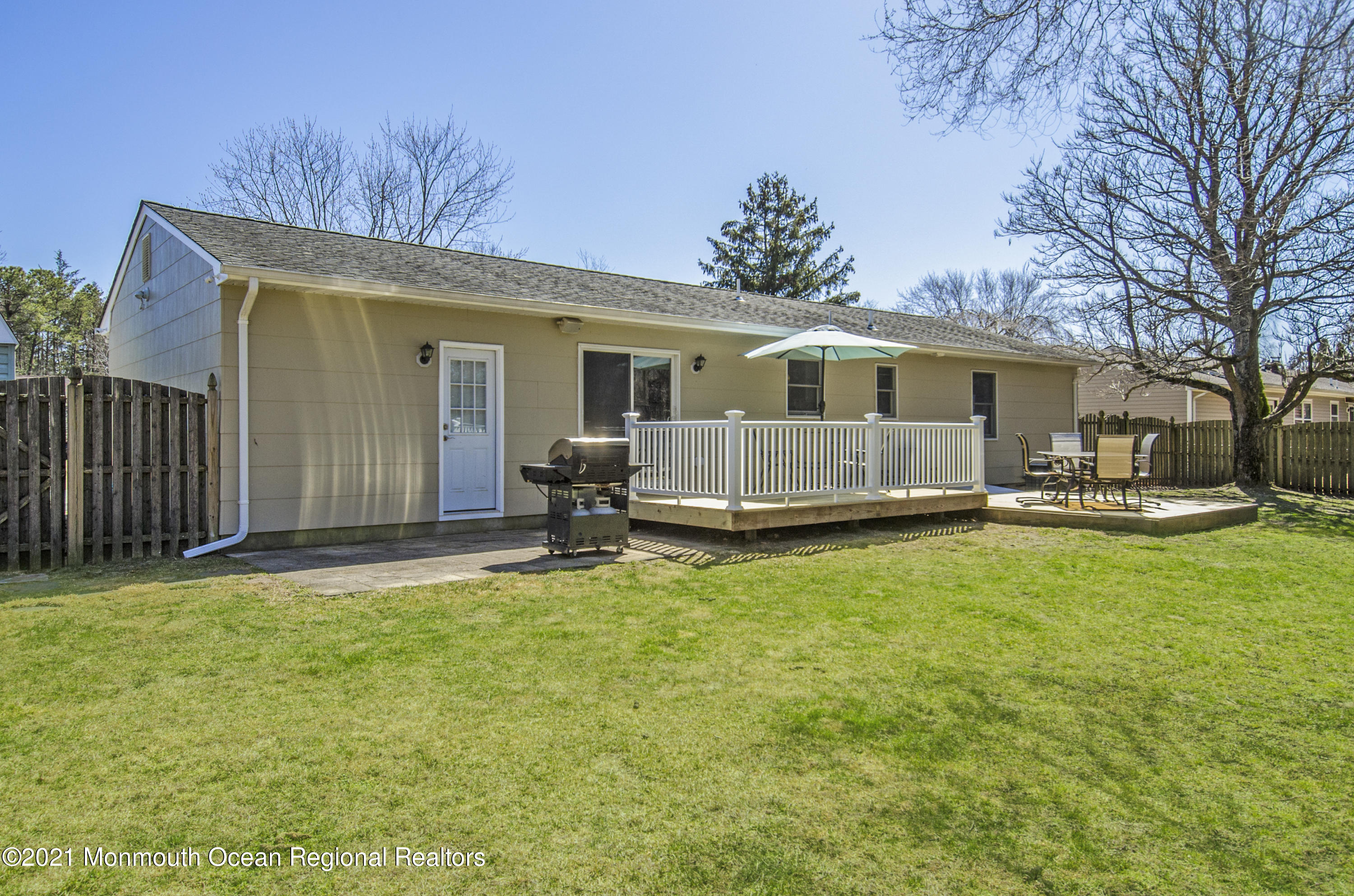 58 Pinewood Drive Brick, NJ 08724 - Photo 26 of 30 a backyard of a house with table and chairs