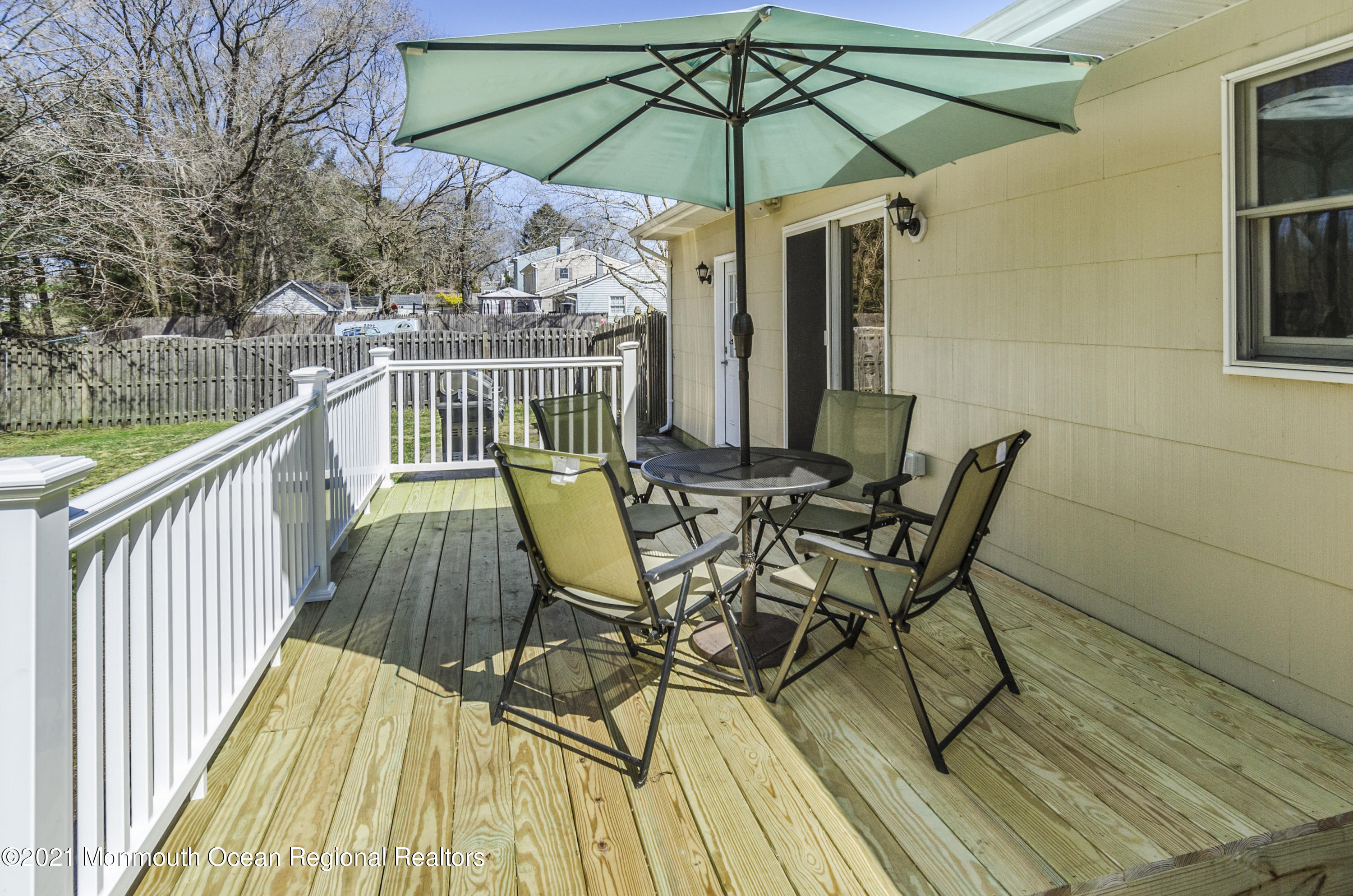 58 Pinewood Drive Brick, NJ 08724 - Photo 28 of 30 a view of deck with furniture and barbeque oven