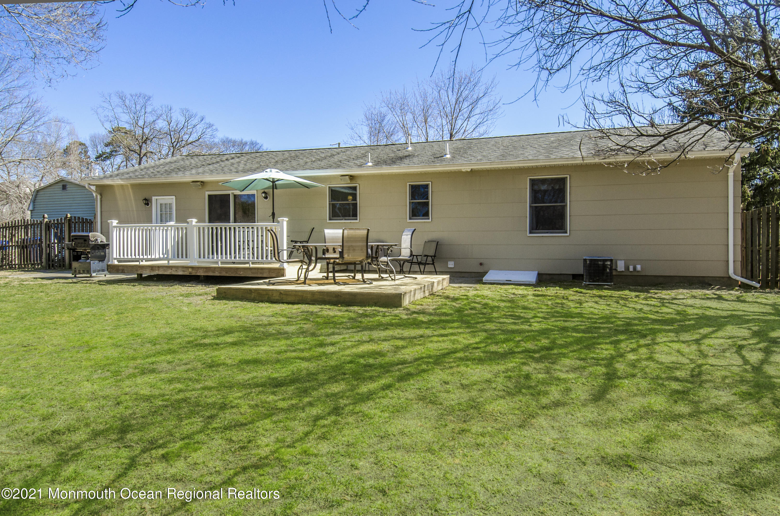 58 Pinewood Drive Brick, NJ 08724 - Photo 29 of 30 a front view of house with yard seating and green space