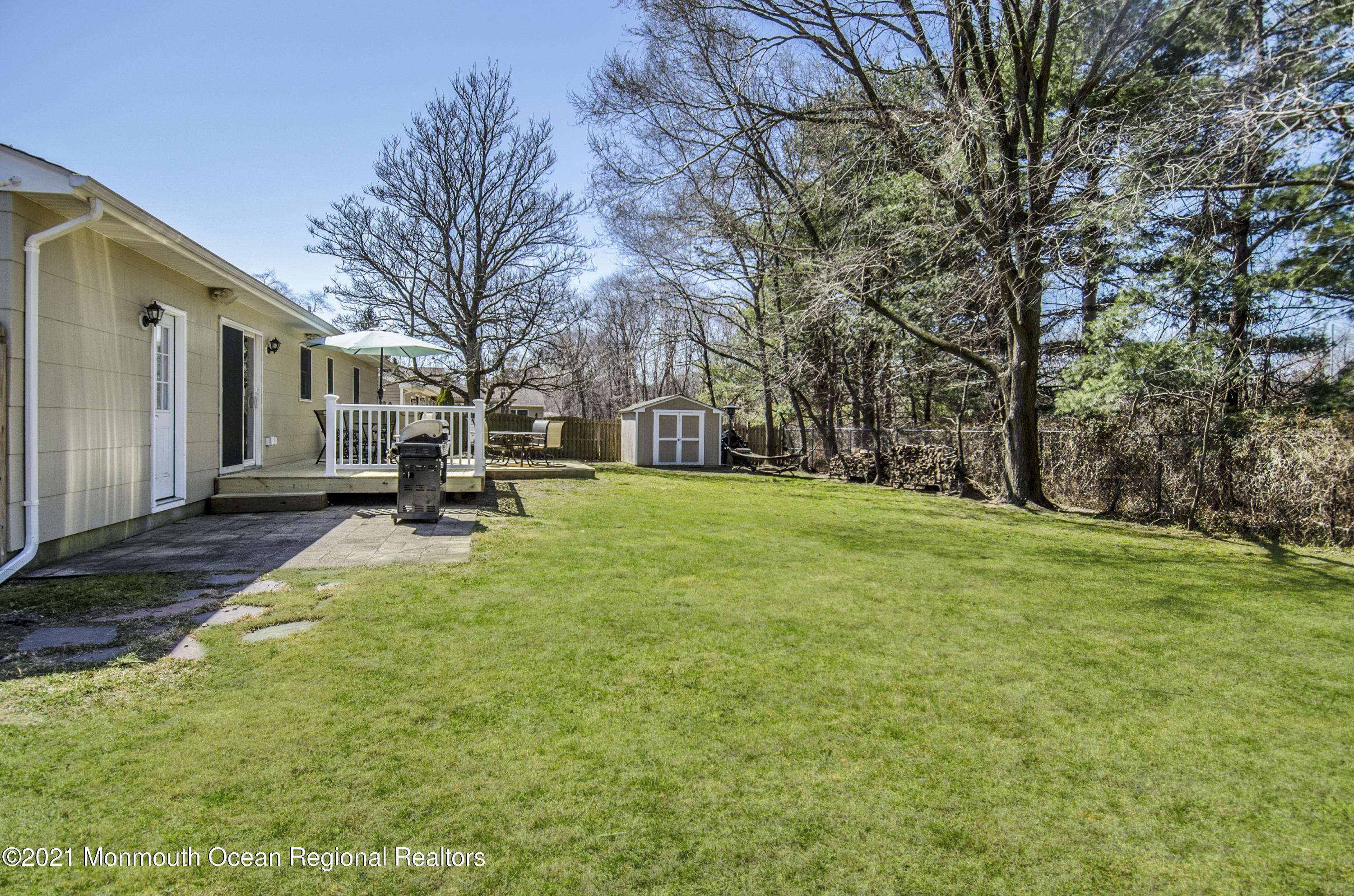 58 Pinewood Drive Brick, NJ 08724 - Photo 30 of 30 a view of a back yard with a house