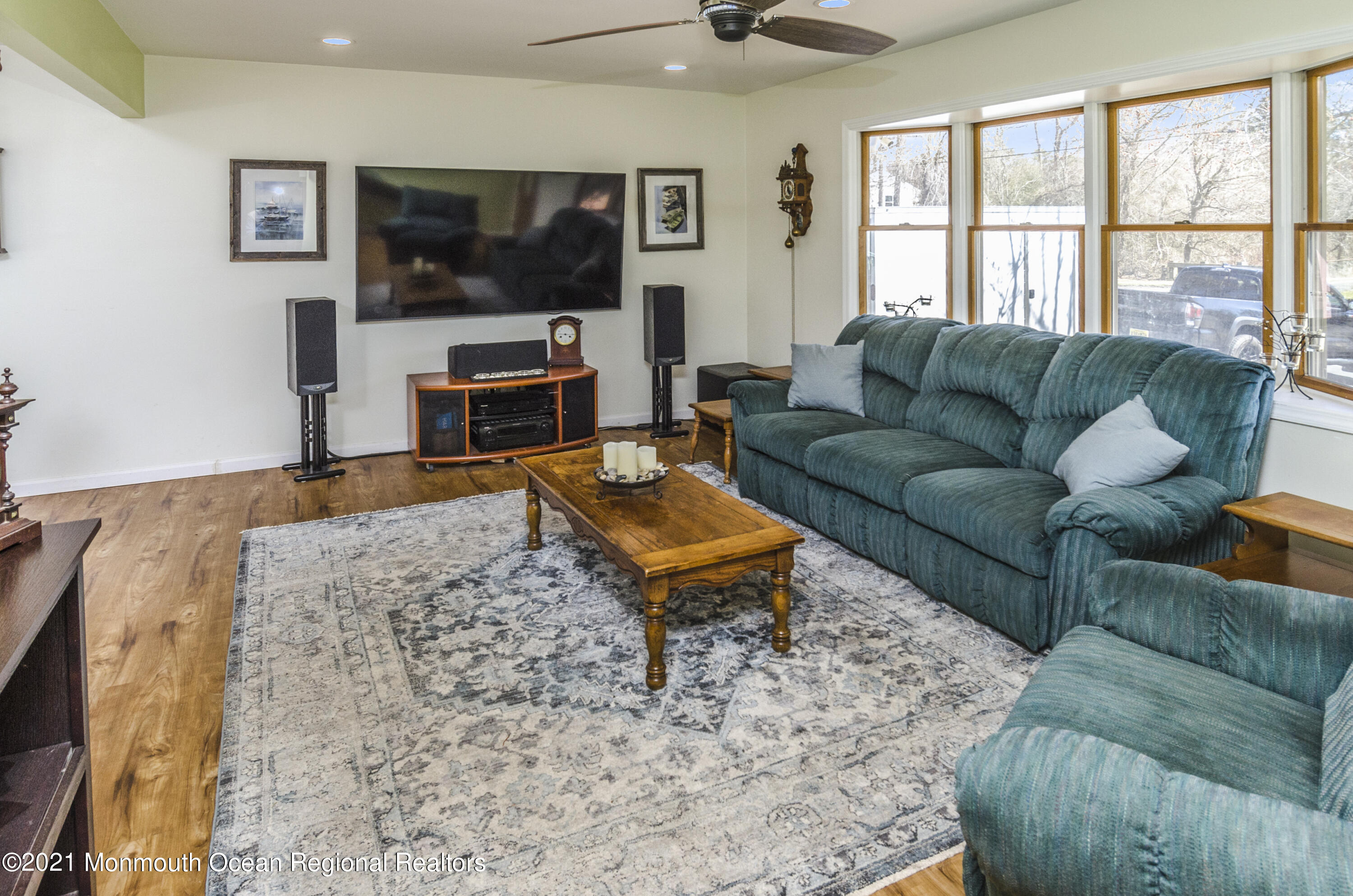 58 Pinewood Drive Brick, NJ 08724 - Photo 7 of 30 a living room with furniture a flat screen tv and a fireplace