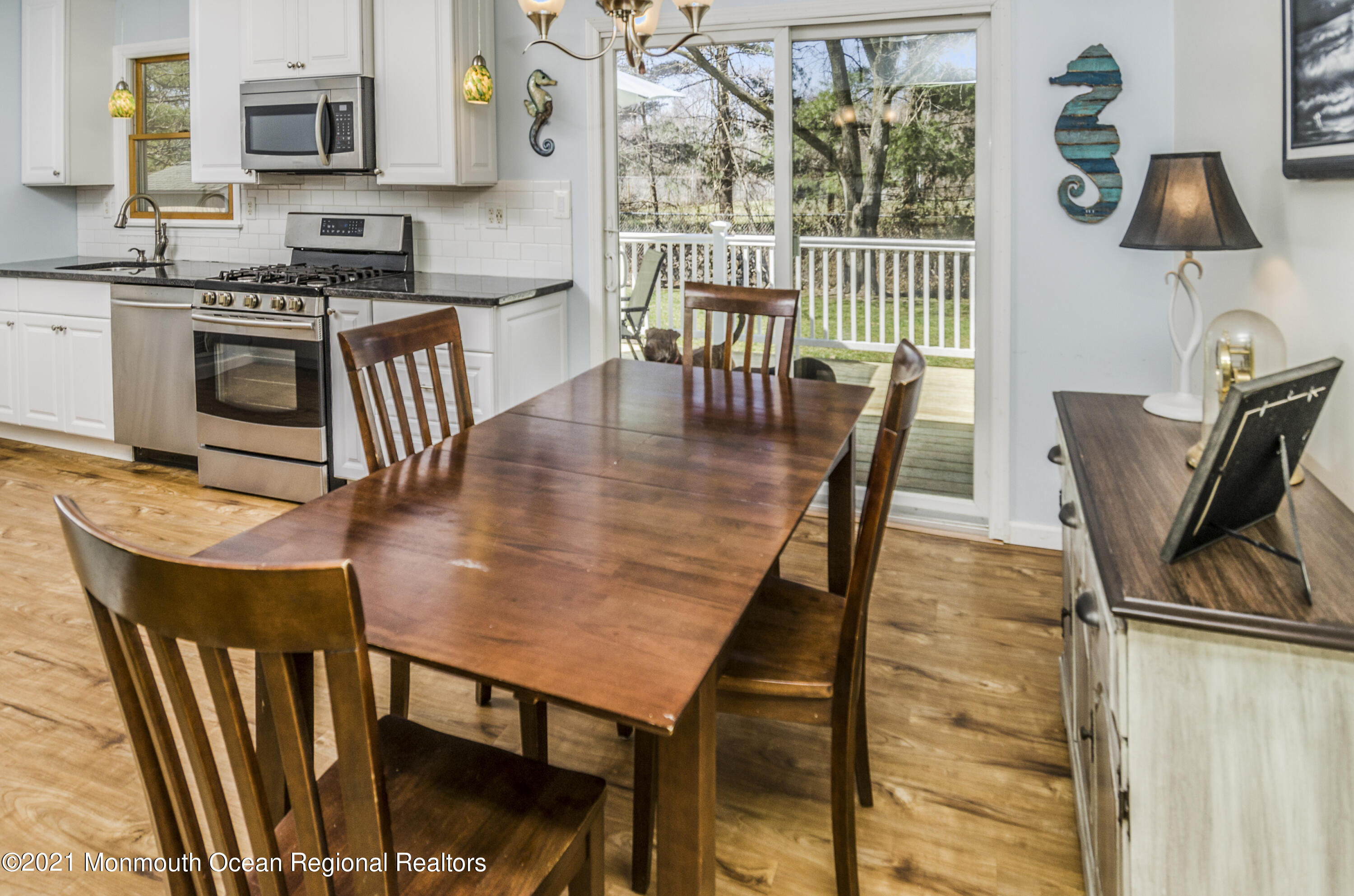 58 Pinewood Drive Brick, NJ 08724 - Photo 9 of 30 a dining room with furniture and wooden floor