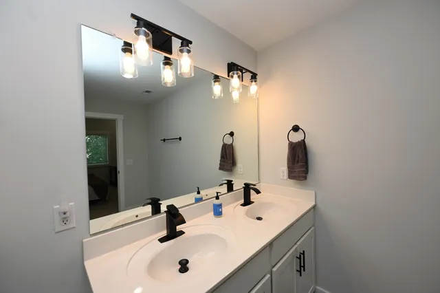 a bathroom with a sink and a mirror