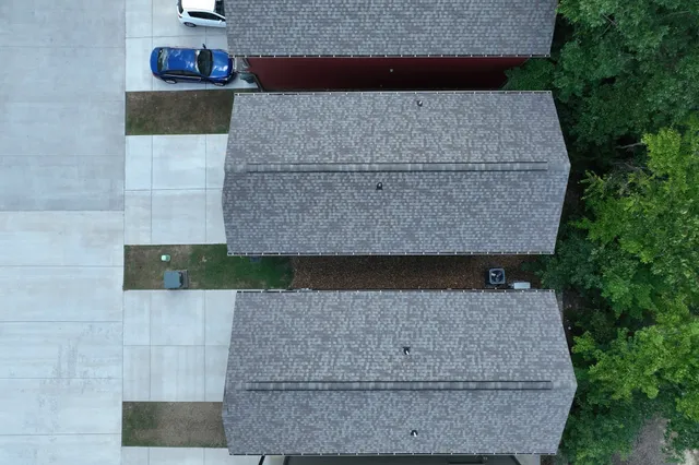 a view of an outdoor space with a door and windows