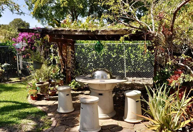 a front view of a house with a fountain