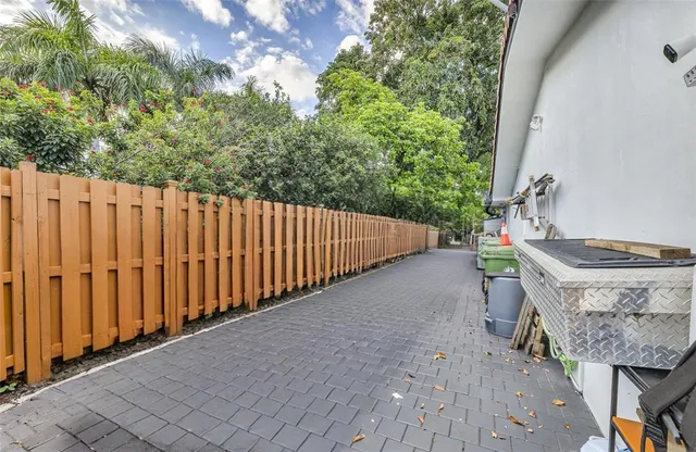 a view of a backyard with pathway