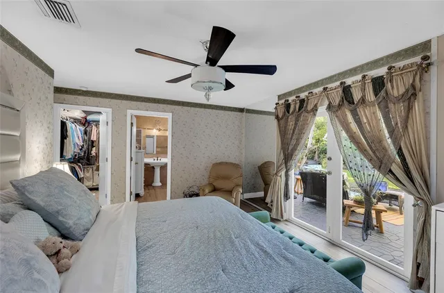 a bedroom with furniture and a window