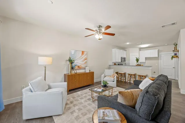 an empty room with wooden floor and mirror