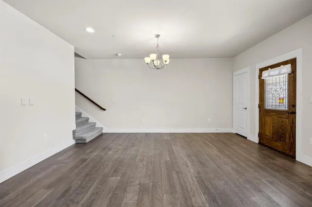a bathroom with a granite countertop sink a toilet and mirror