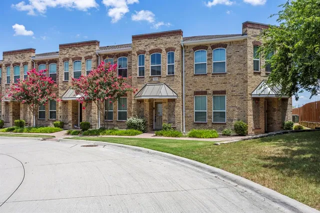 a front view of building with yard