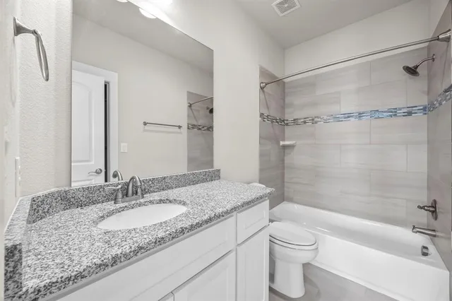 a view of yard with seating space and trees in the background