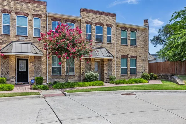 a dining room with a wooden table and chairs