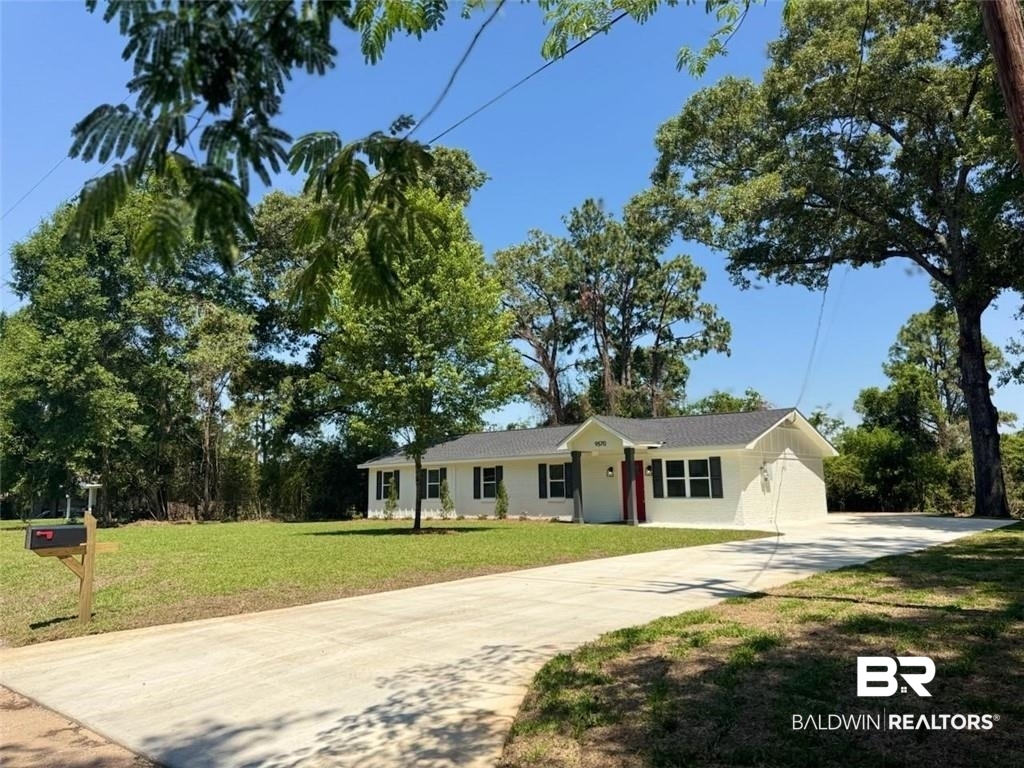 9570 Melanie Lane Semmes, AL 36575 - Photo 3 of 8 Single story home with driveway and a front yard