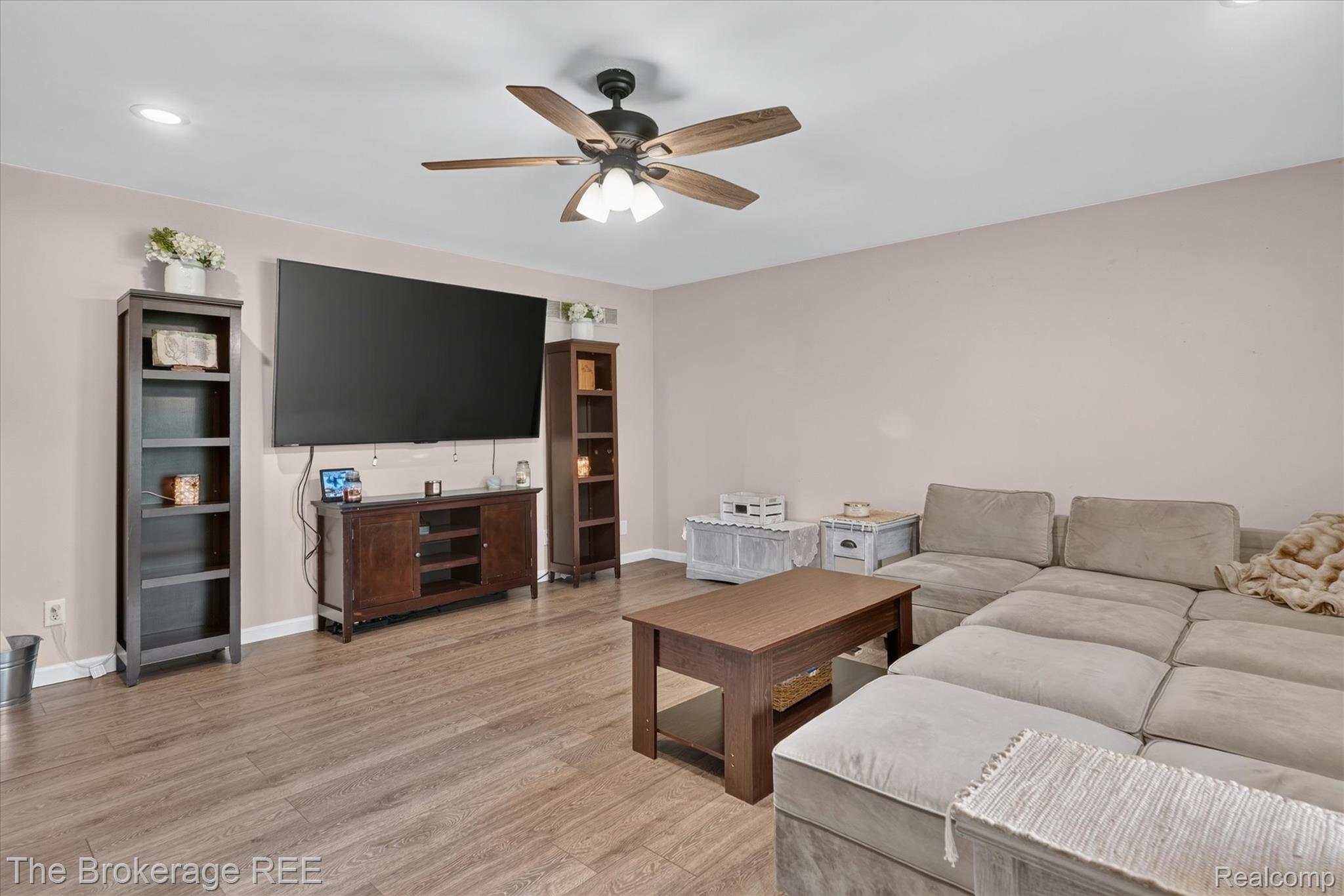 13269 North Genesee Road Clio, MI 48420 - Photo 13 of 67 Living area featuring wood-finish flooring, recessed lighting, and a ceiling fan with integrated lighting