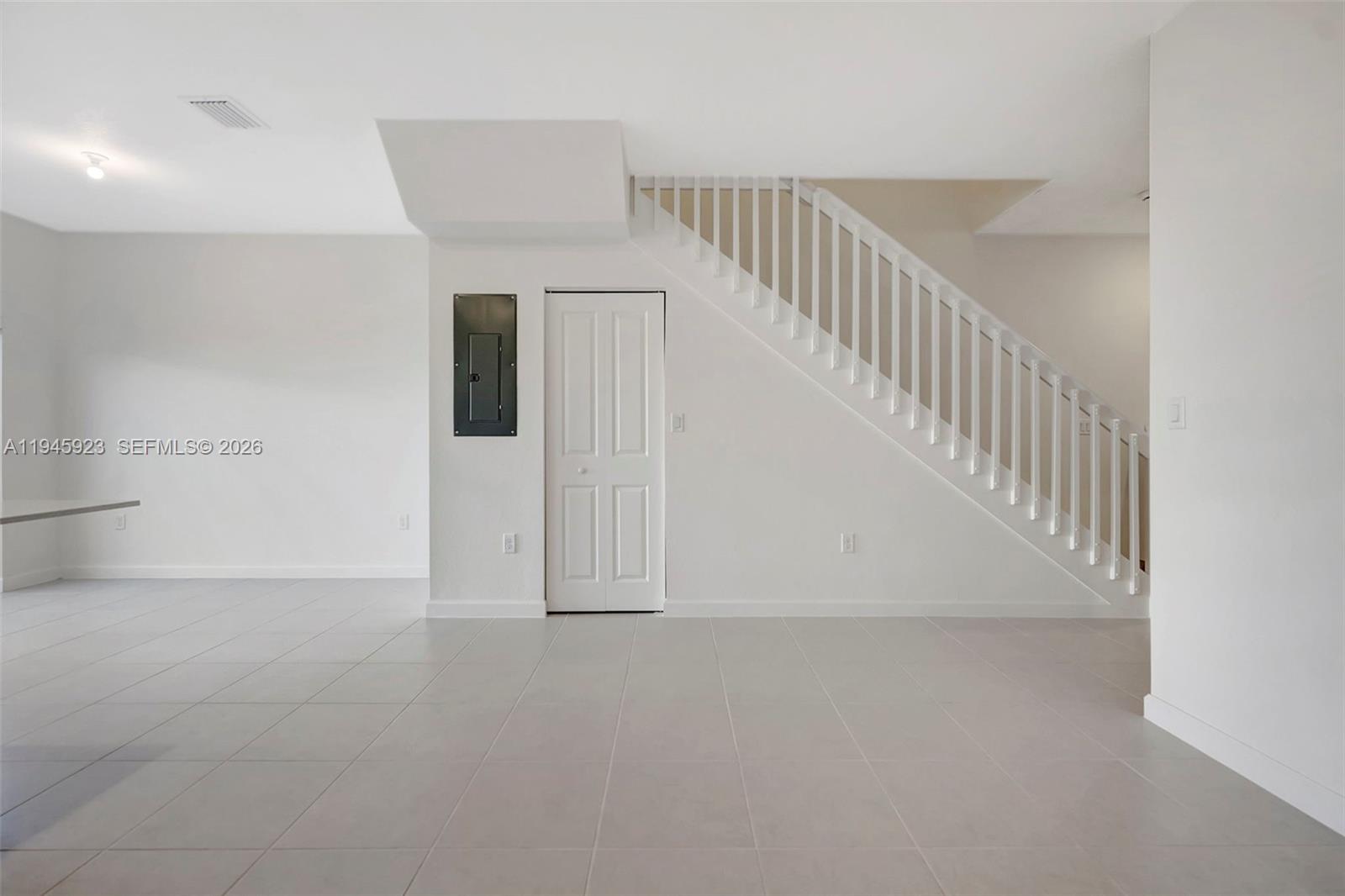 2455 Northwest 119th Street Miami, FL 33167 - Photo 13 of 38 a view of an entryway with staircase