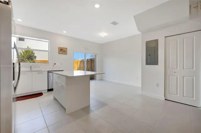 a view of a kitchen with furniture and window