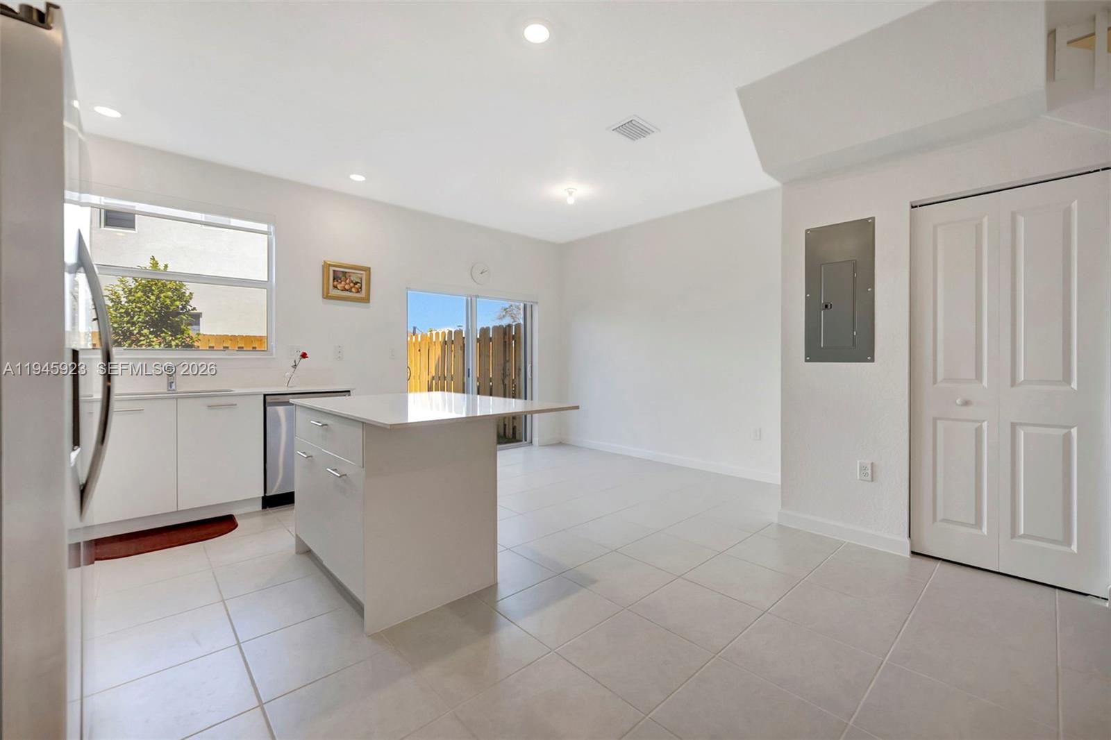 2455 Northwest 119th Street Miami, FL 33167 - Photo 14 of 38 a view of a kitchen with furniture and window