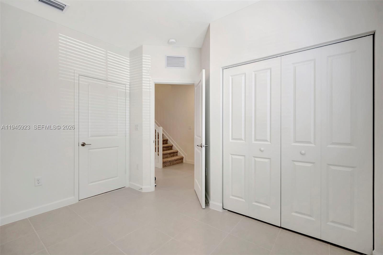 2455 Northwest 119th Street Miami, FL 33167 - Photo 16 of 38 a view of a room with a white walls