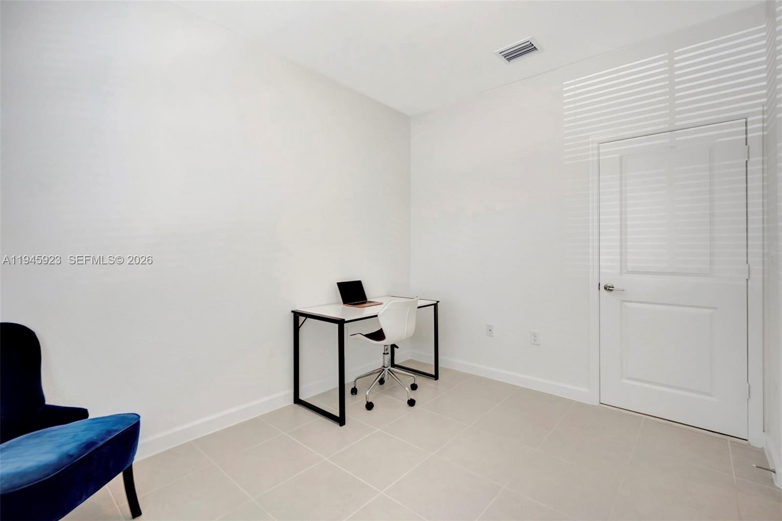 2455 Northwest 119th Street Miami, FL 33167 - Photo 19 of 38 a view of workspace with lounge chair
