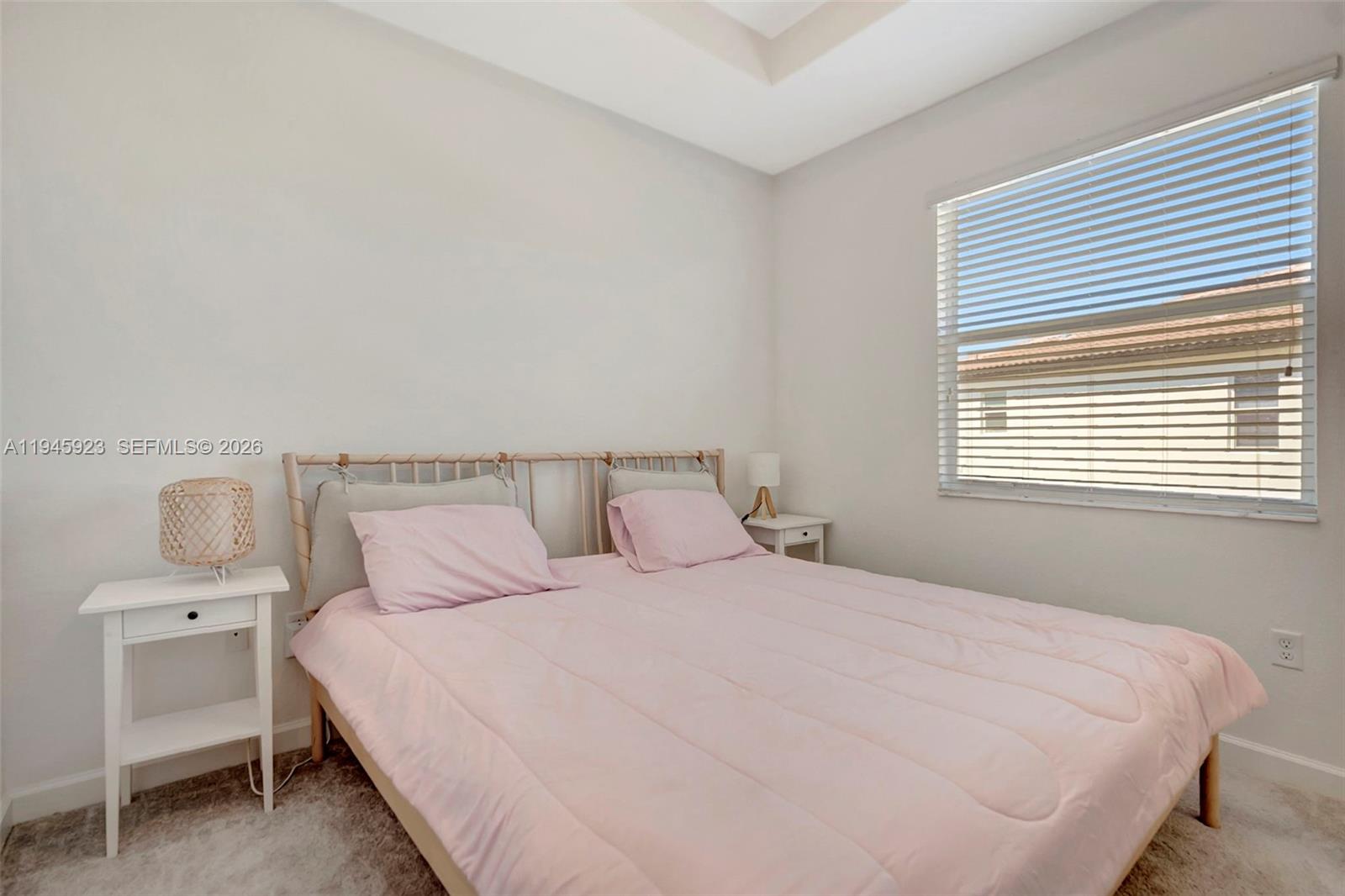 2455 Northwest 119th Street Miami, FL 33167 - Photo 21 of 38 a bedroom with a bed and a window