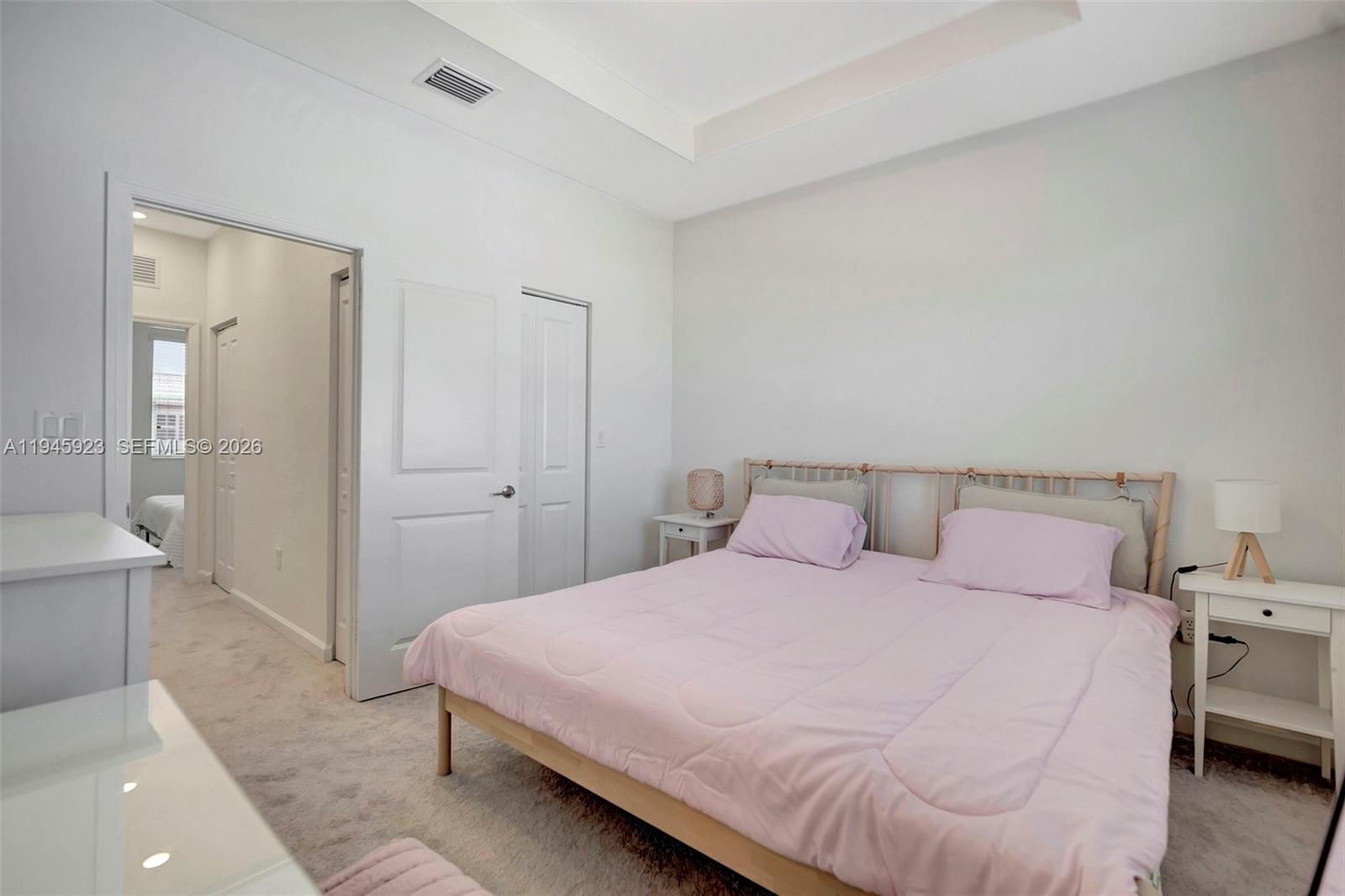 2455 Northwest 119th Street Miami, FL 33167 - Photo 22 of 38 a bedroom with a bed and a couch